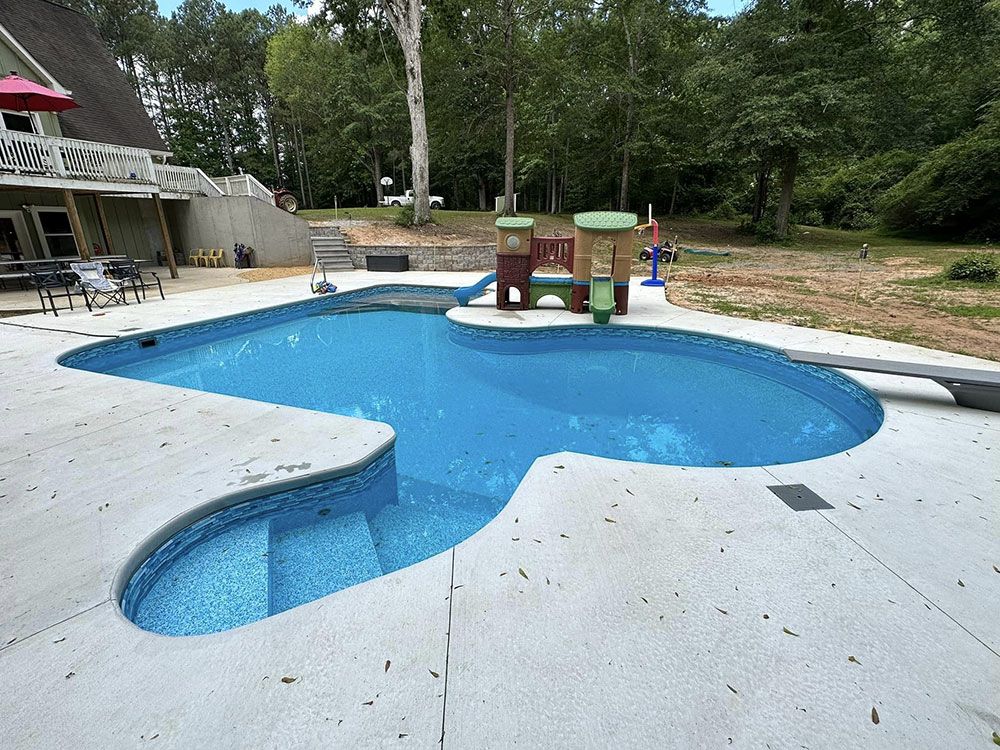 Pool with Serenity liner, liner covered stairs, and sundeck