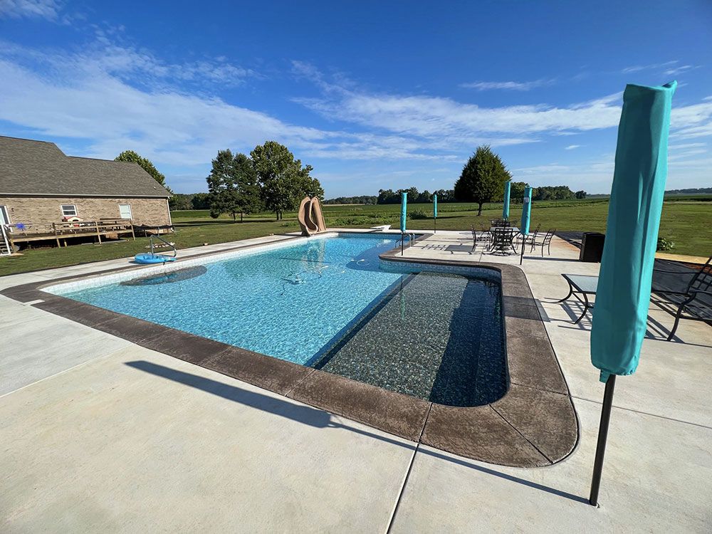 Pool with Oasis liner, liner covered stairs, and sundeck